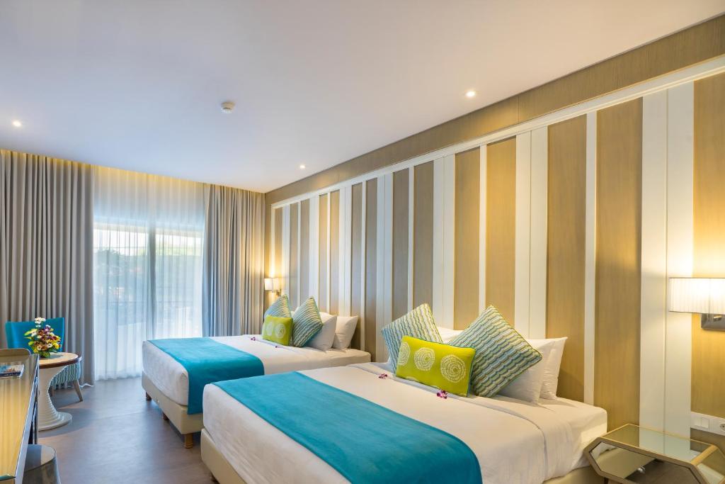 Postel nebo postele na pokoji v ubytování Grand Mirage Resort & Thalasso Bali