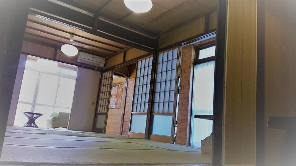 Postel nebo postele na pokoji v ubytování 石垣島 一棟貸切りのお宿 ちゅら赤瓦