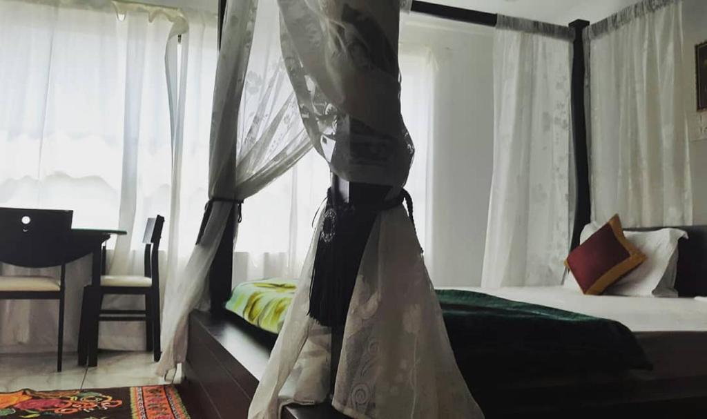 Postel nebo postele na pokoji v ubytování Rahul Residency