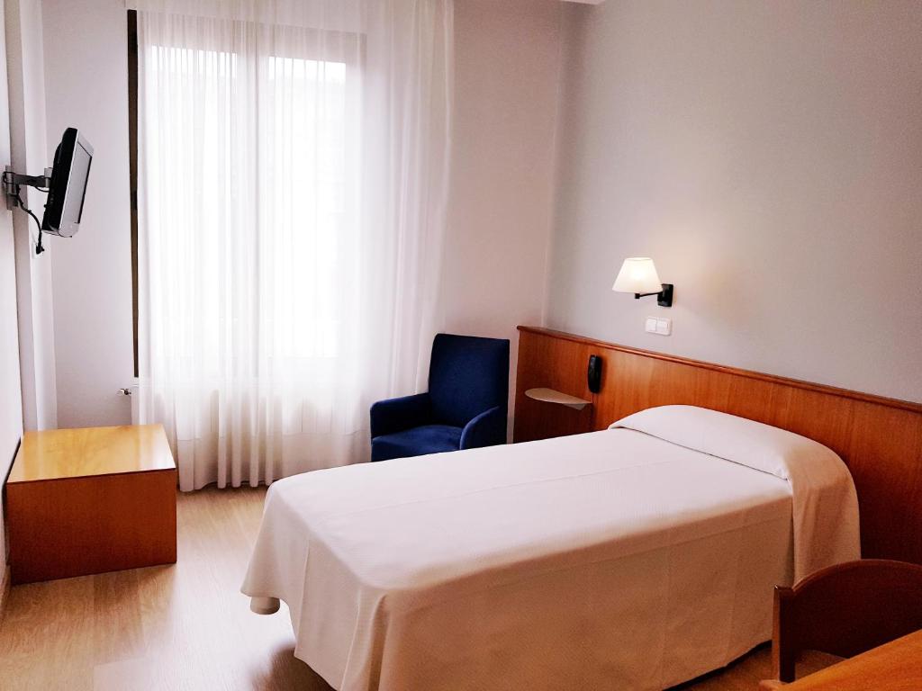 Postel nebo postele na pokoji v ubytování Peninsular