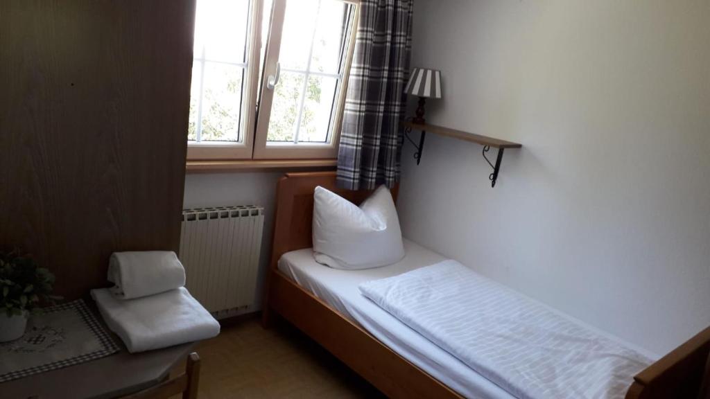 Voodi või voodid majutusasutuse Gasthaus Moosegg toas
