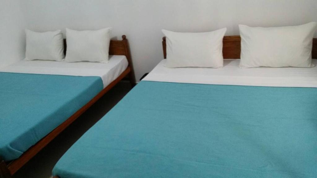 Postel nebo postele na pokoji v ubytování Tea Breeze Motel