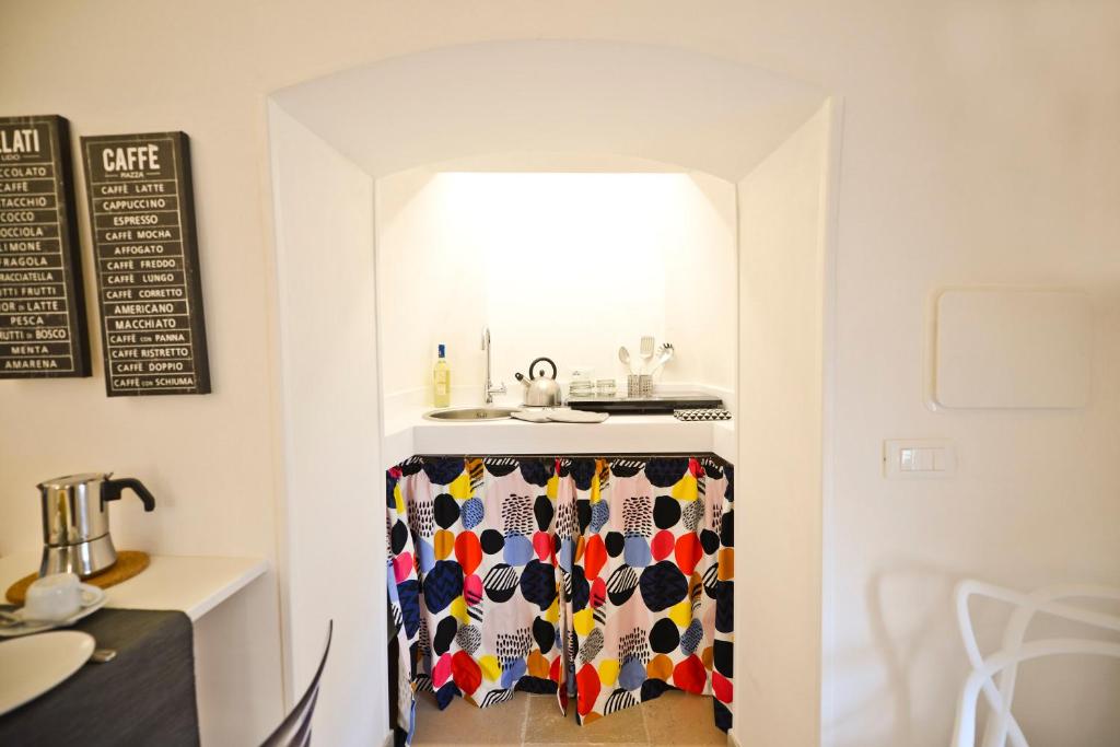 A kitchen or kitchenette at Scirocco Apartment with terrace by Wonderful Italy