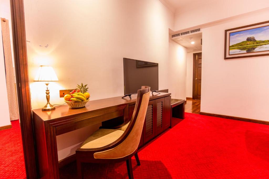 TV a/nebo společenská místnost v ubytování Trillium Boutique City Hotel