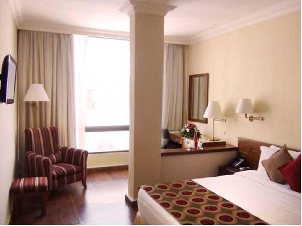 Postel nebo postele na pokoji v ubytování Orient Prince Hotel
