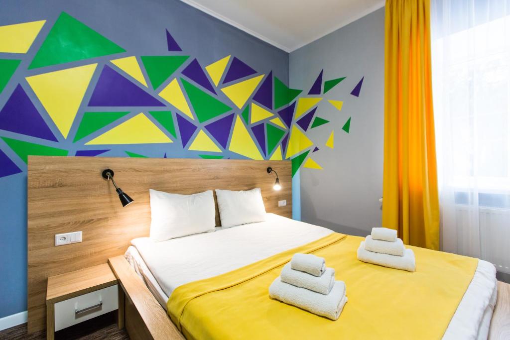 Ліжко або ліжка в номері Blum Hotel