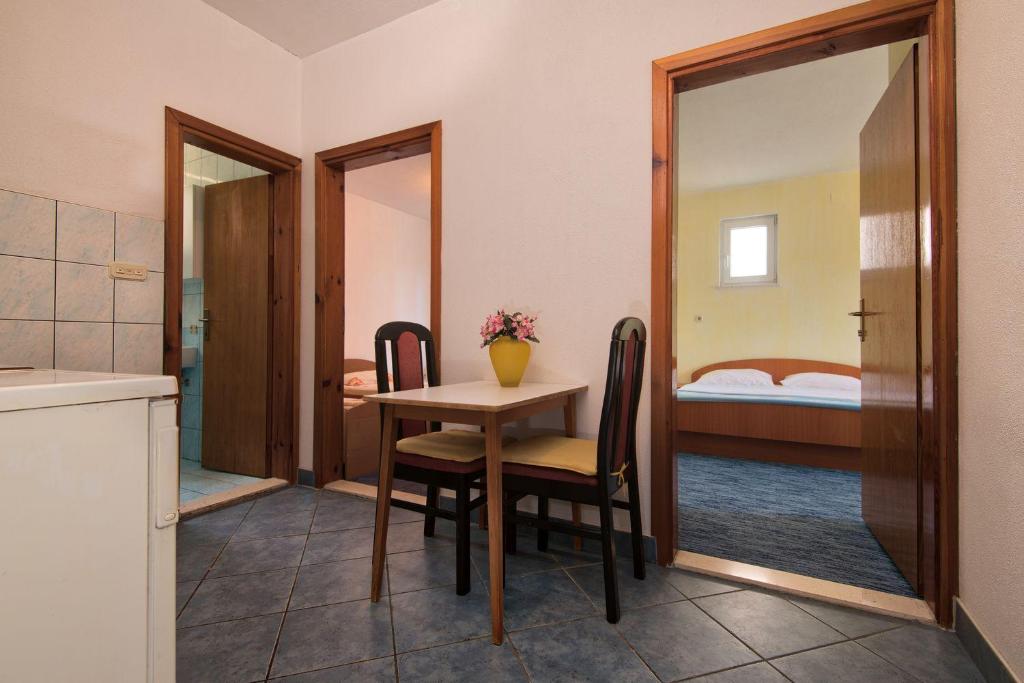 Postel nebo postele na pokoji v ubytování Apartmani Jogunica