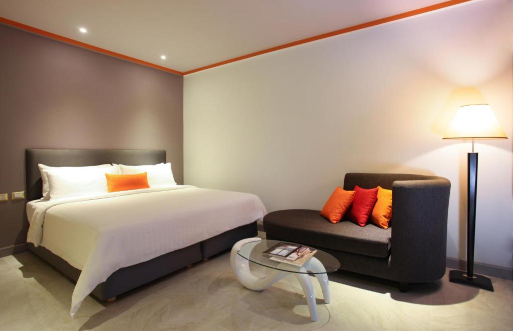 Postel nebo postele na pokoji v ubytování Chabana Kamala Hotel