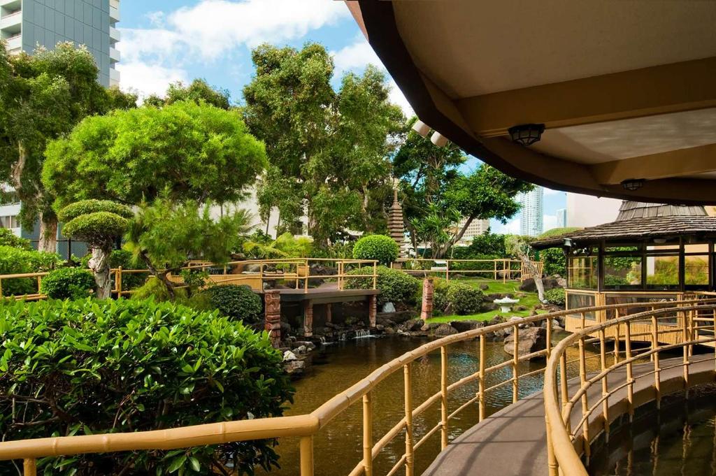 a view of a park with a river and trees at Pagoda Hotel in Honolulu