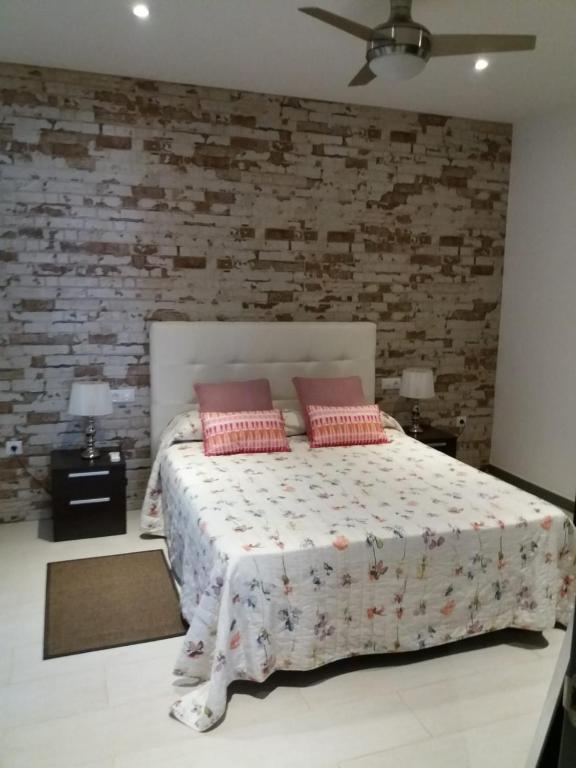 Postel nebo postele na pokoji v ubytování Villa FranyMar