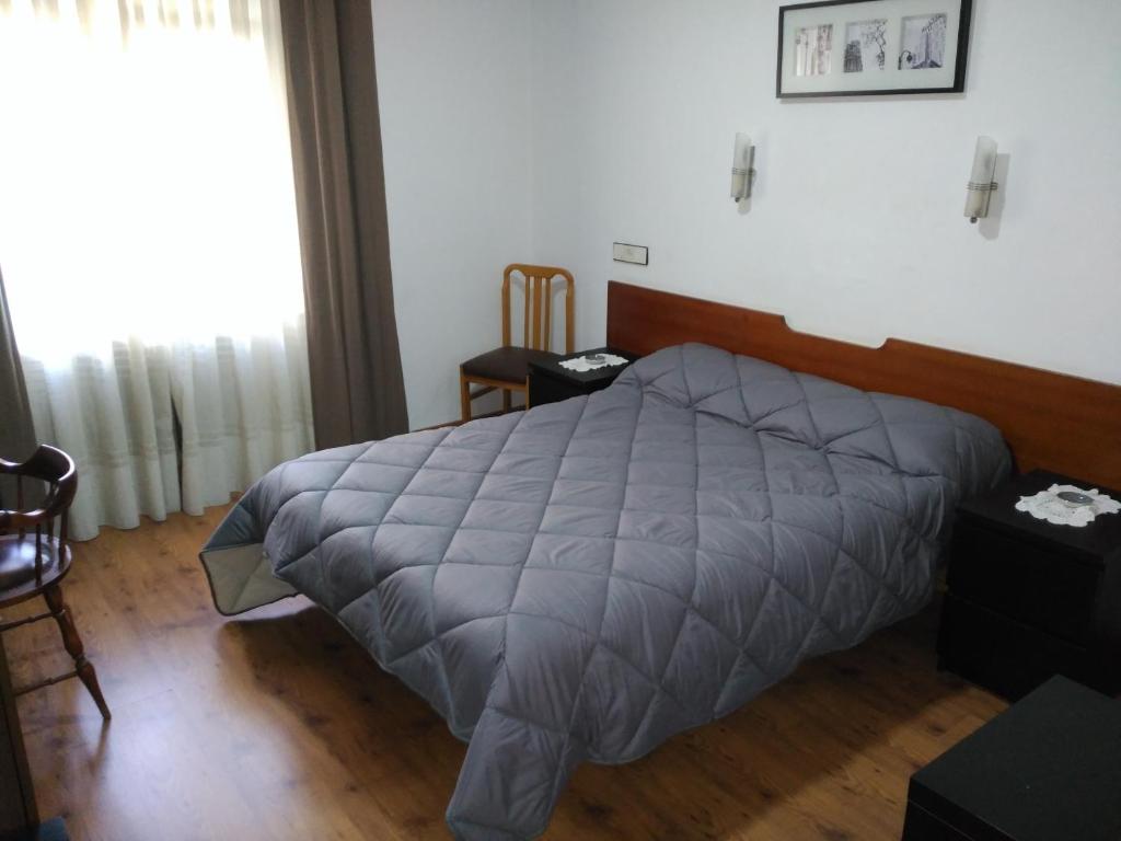 Postel nebo postele na pokoji v ubytování Hotel Vaqueros