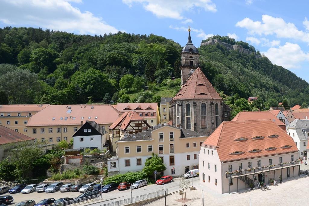 a view of a town with a church on a hill at Grafenblick, Ferienwohnung mit Aussicht! in Elbe