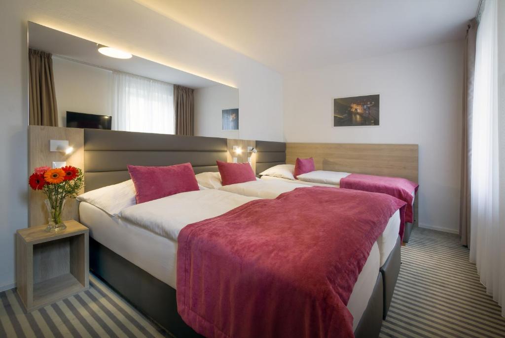 Ένα ή περισσότερα κρεβάτια σε δωμάτιο στο Hotel White Lion