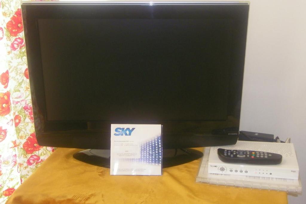 A television and/or entertainment centre at Hotel Galassi