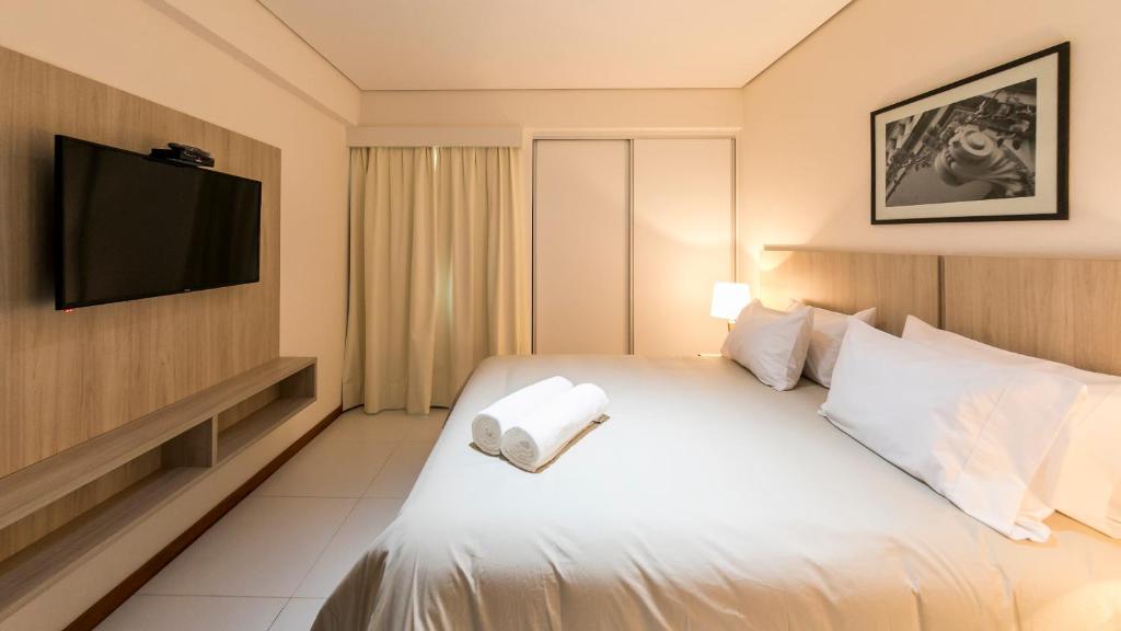 Postel nebo postele na pokoji v ubytování Asuncion Rent Suites Centro