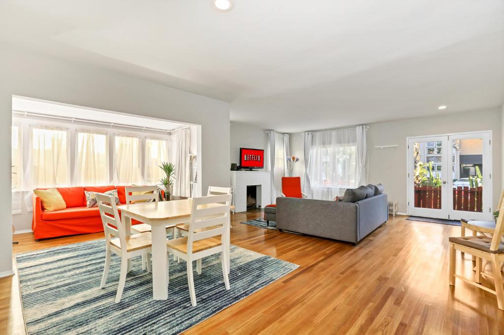 a living room with a table and a couch at Long Beach House in Long Beach