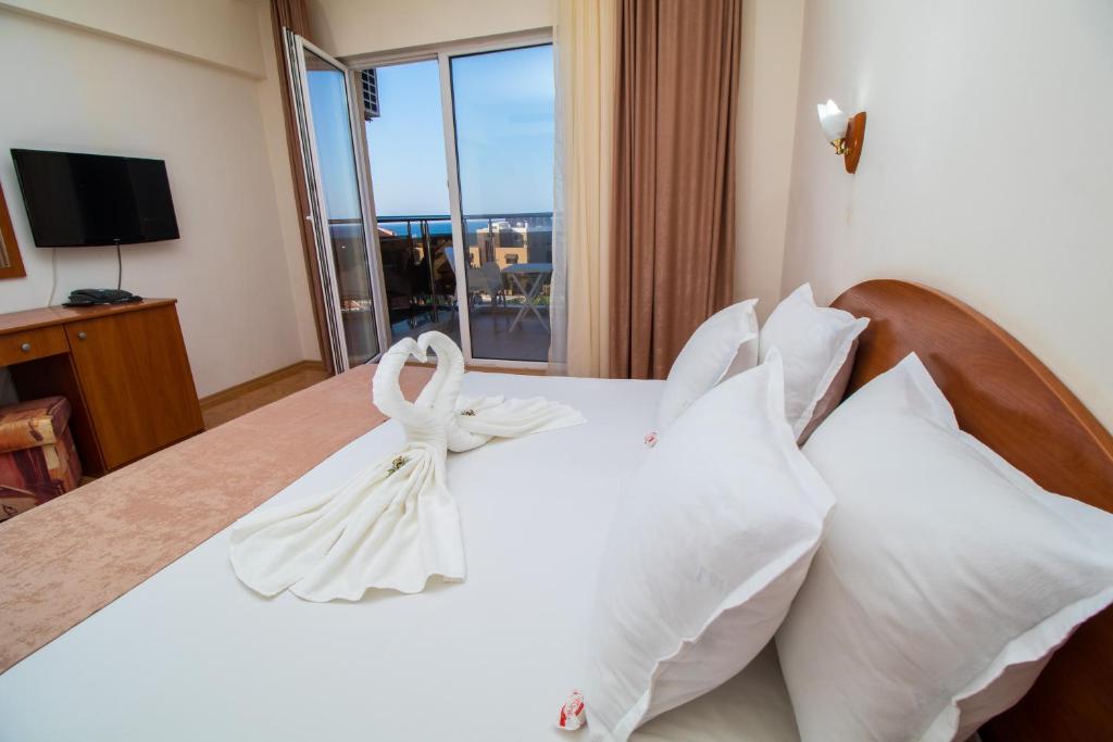 Postel nebo postele na pokoji v ubytování Hotel Sunny