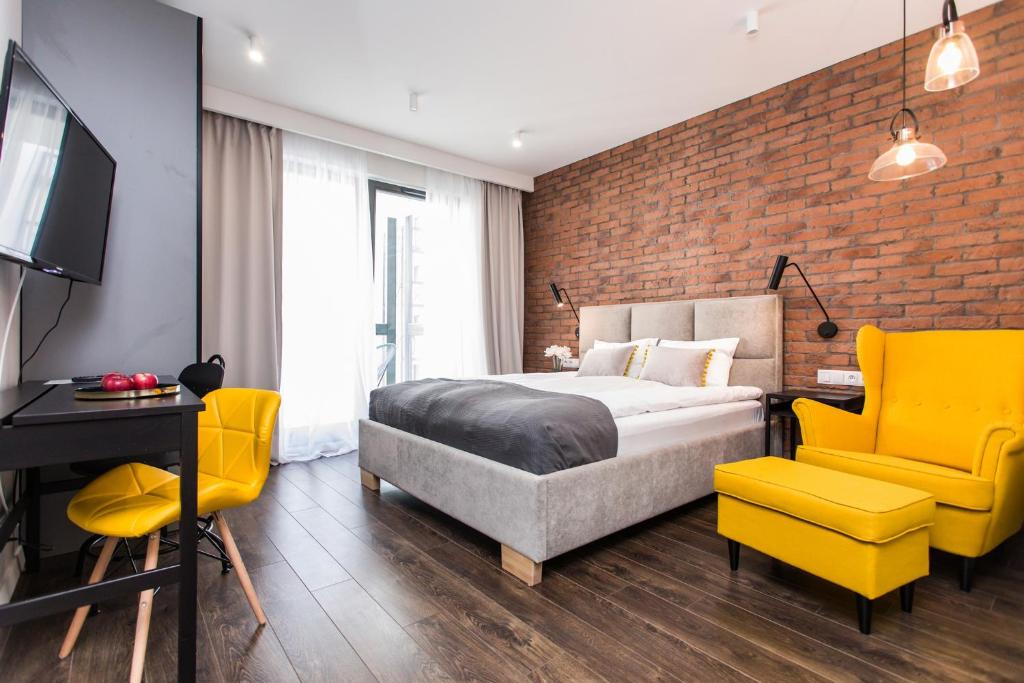 Modern & Classy Industrial - Apartamenty Browar Gdańskにあるベッド