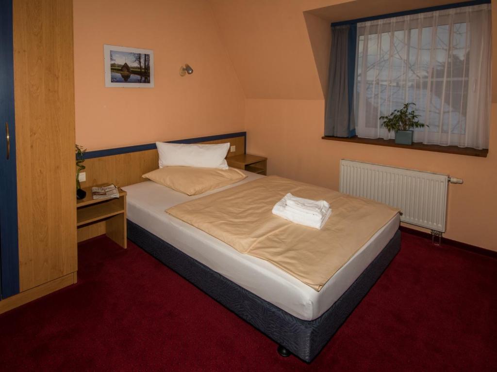 Postel nebo postele na pokoji v ubytování Radduscher Hafen