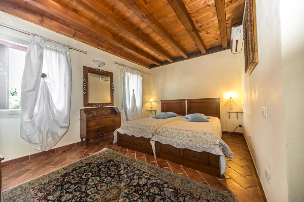 Postel nebo postele na pokoji v ubytování Ca' Noemi