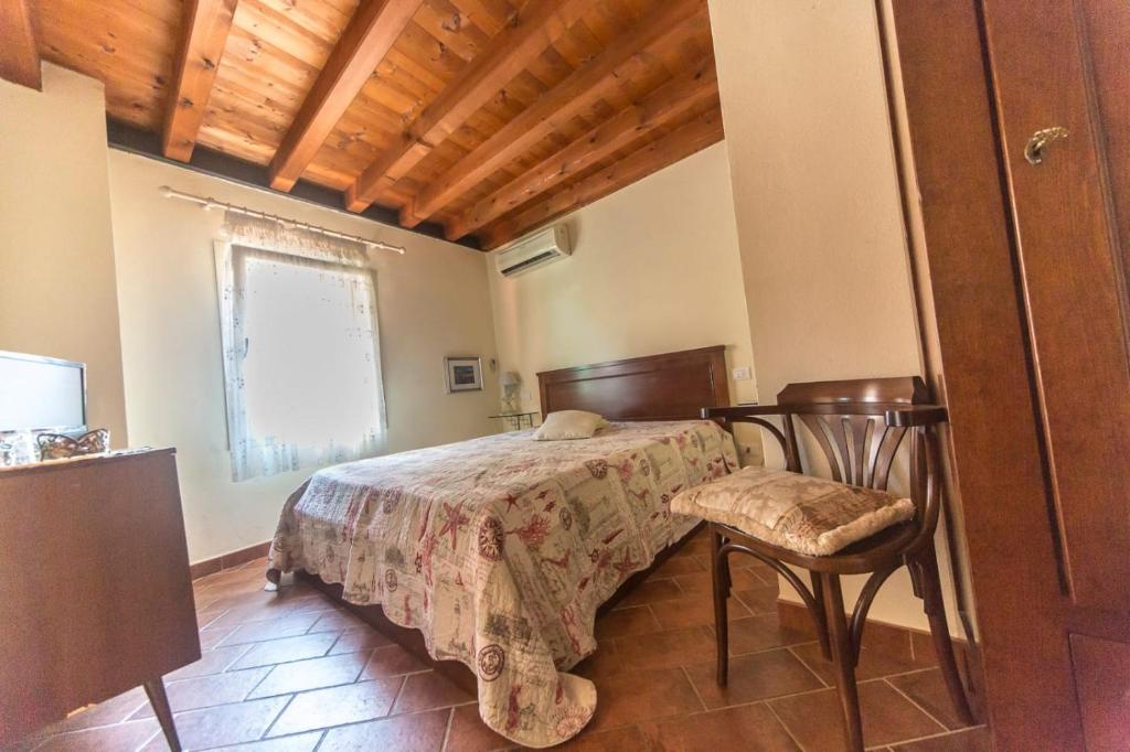 Postel nebo postele na pokoji v ubytování Ca' Noemi