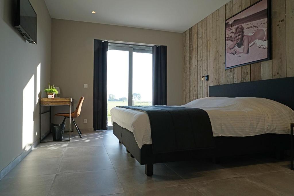 Postel nebo postele na pokoji v ubytování B&B Ten Doele