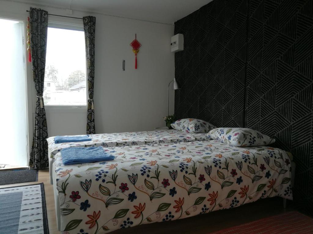 Postel nebo postele na pokoji v ubytování Lin's B&B