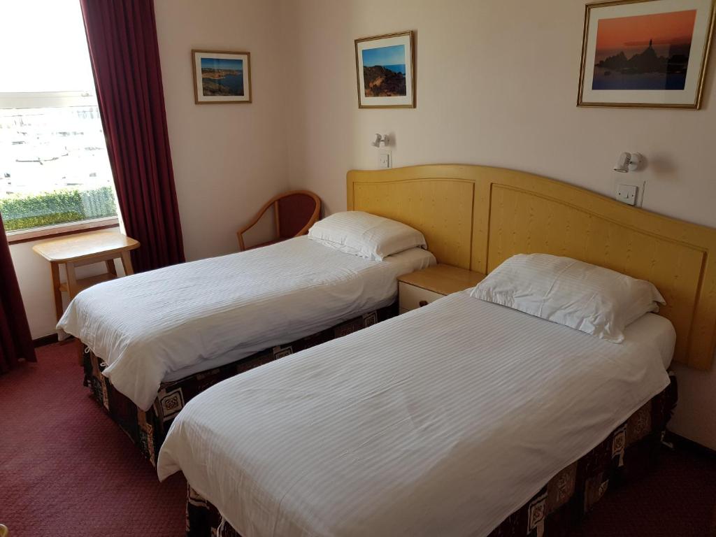 Postel nebo postele na pokoji v ubytování Bon Viveur Guest House