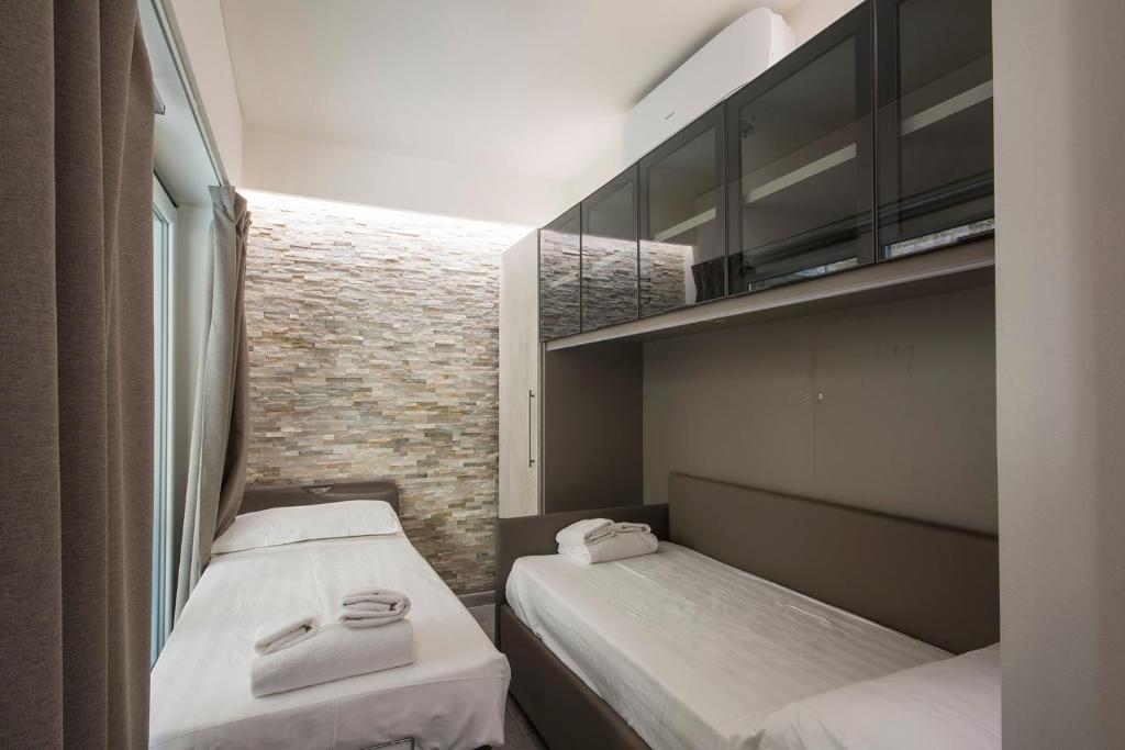 Łóżko lub łóżka w pokoju w obiekcie Pitti Apartment