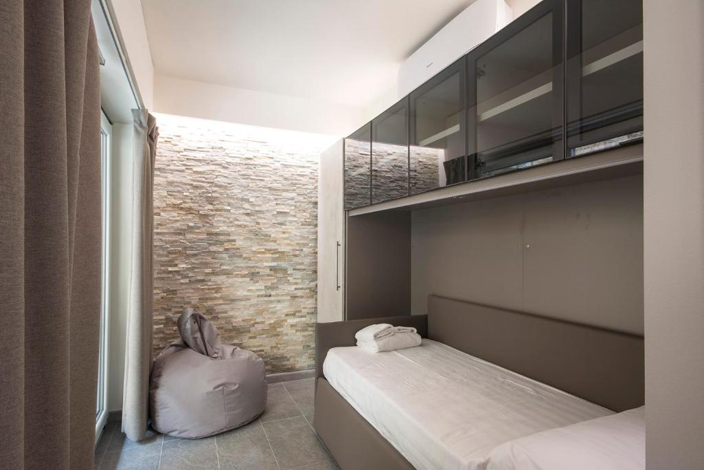 Łóżko lub łóżka w pokoju w obiekcie Pitti Apartment