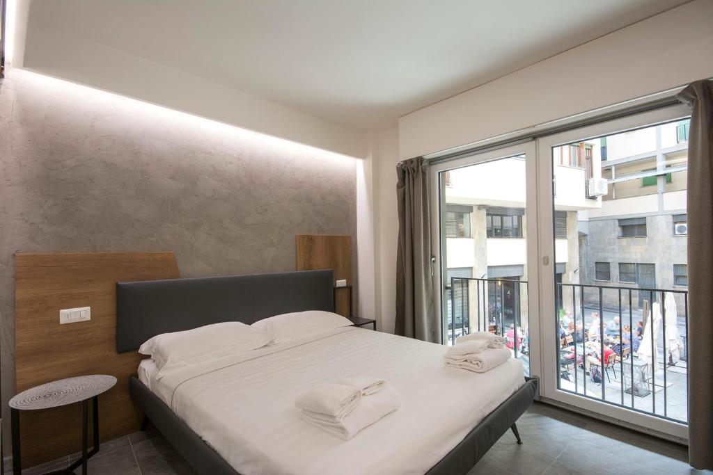 Łóżko lub łóżka w pokoju w obiekcie Pitti Apartment