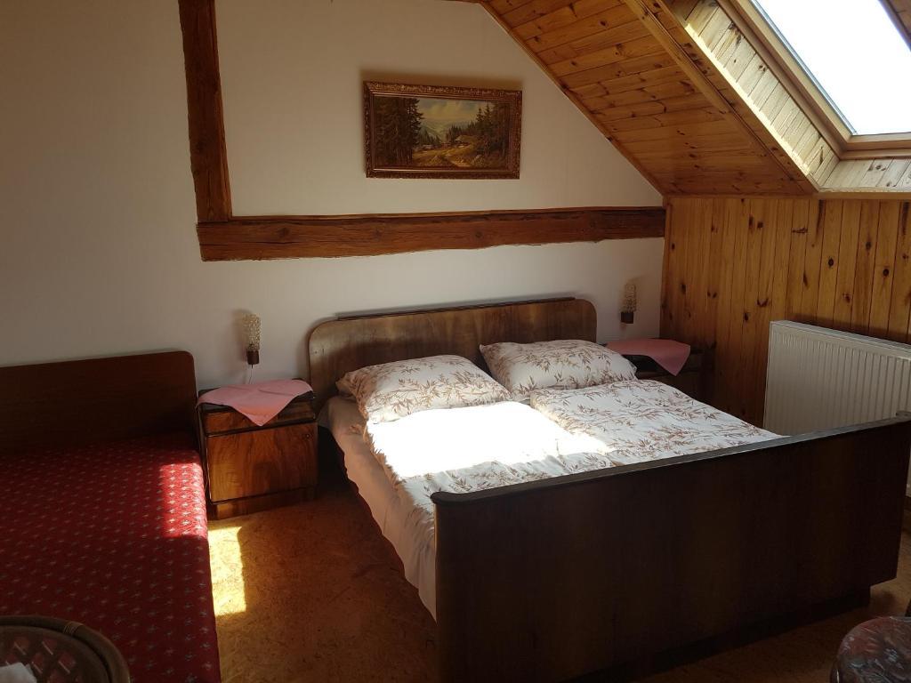 Postel nebo postele na pokoji v ubytování Hostinec Selský dvůr