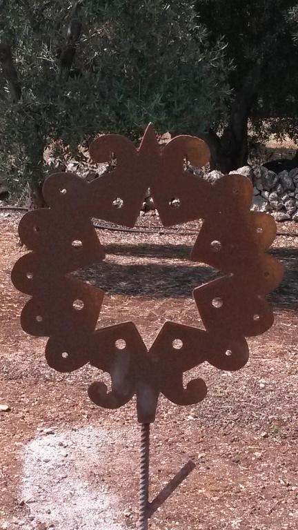 a metal object that looks like a butterfly at Case d'Artista in Savelletri di Fasano
