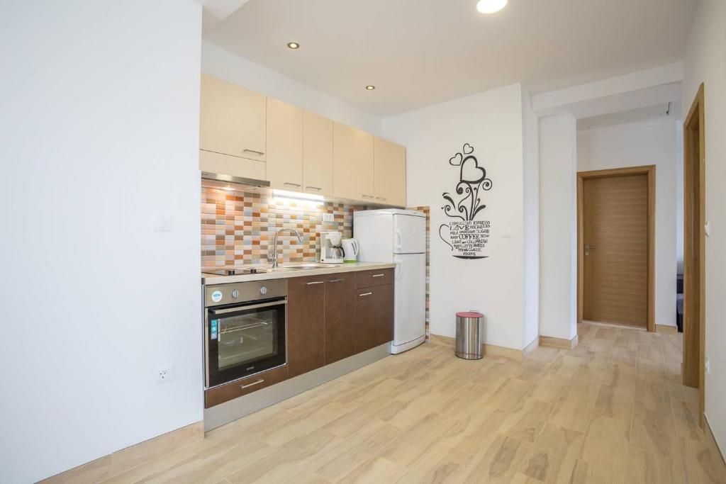 Kuchyň nebo kuchyňský kout v ubytování Apartments Franičević