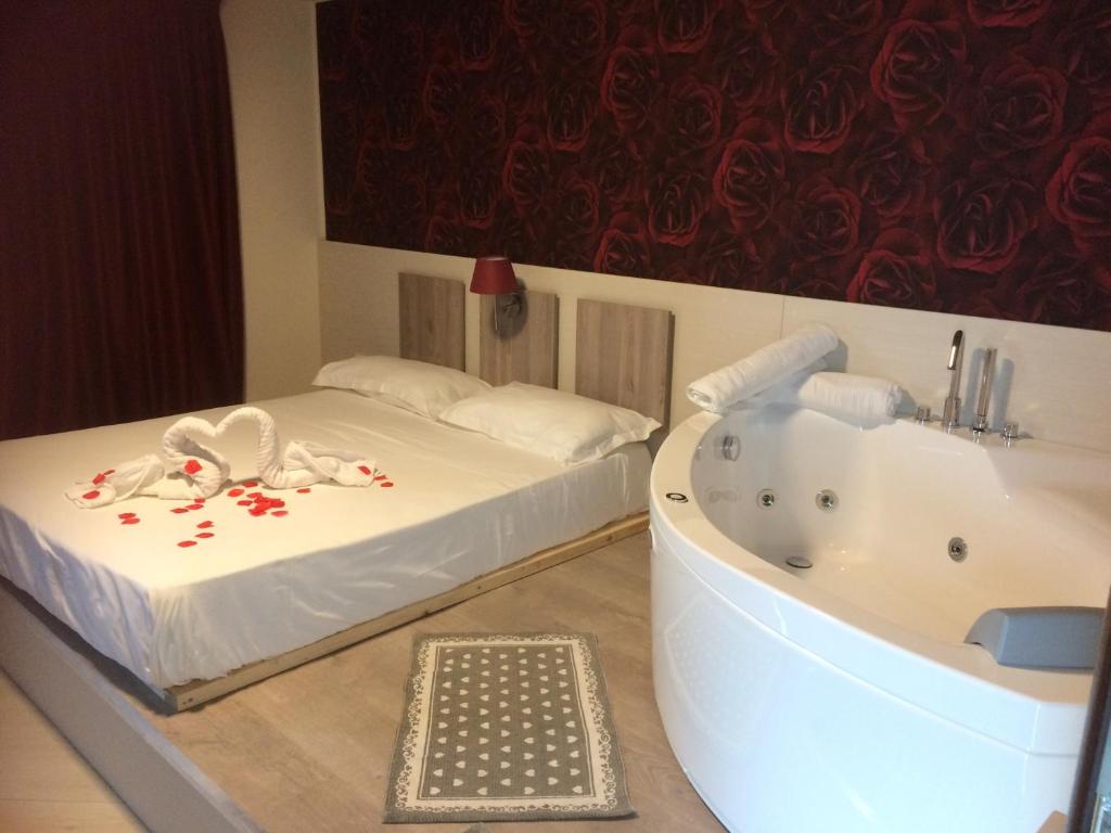 Postel nebo postele na pokoji v ubytování Hotel Cliché
