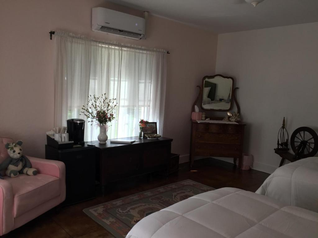 Postel nebo postele na pokoji v ubytování Casa Paloma B&B