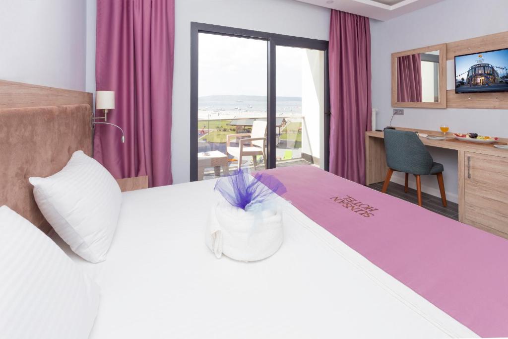 Postel nebo postele na pokoji v ubytování Sunsan Hotel