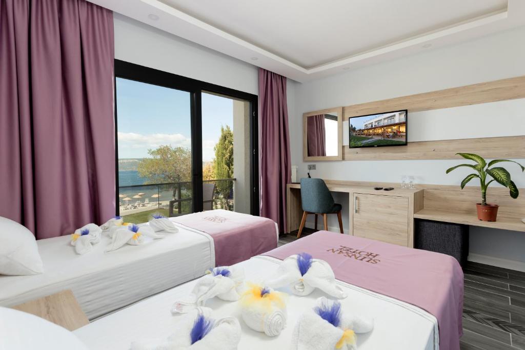 Postel nebo postele na pokoji v ubytování Sunsan Hotel