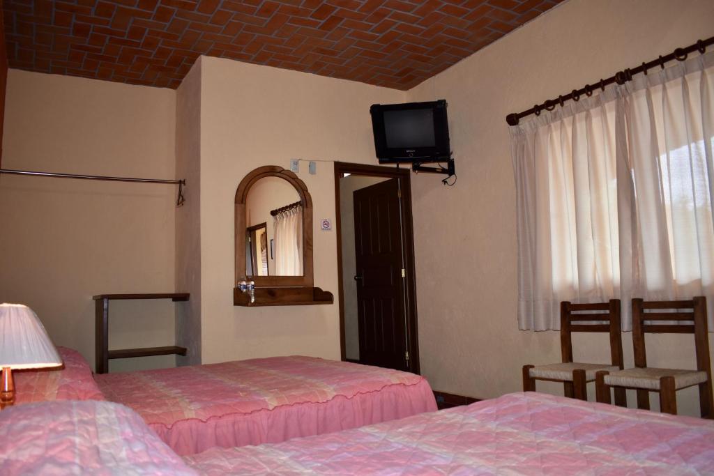 Postel nebo postele na pokoji v ubytování Posada Rincon Magico