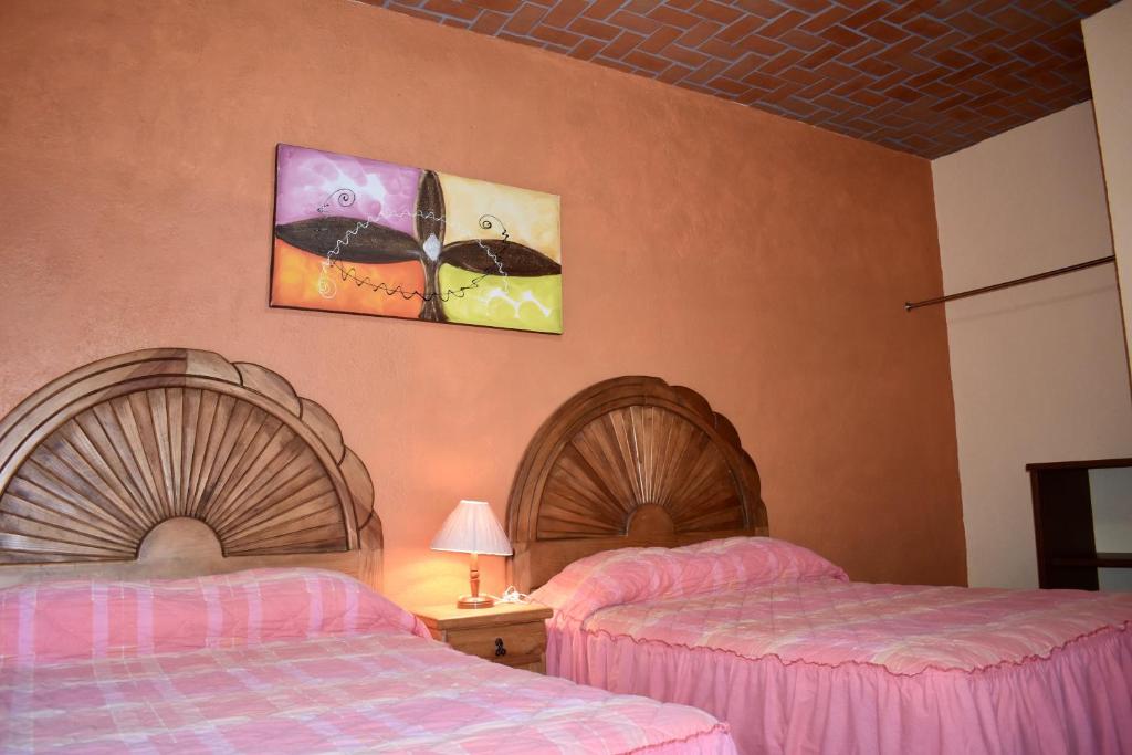 Postel nebo postele na pokoji v ubytování Posada Rincon Magico