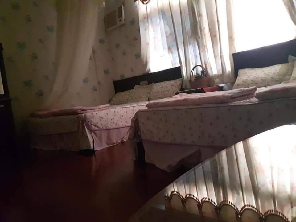 Postel nebo postele na pokoji v ubytování Dai Yi Shia B&B