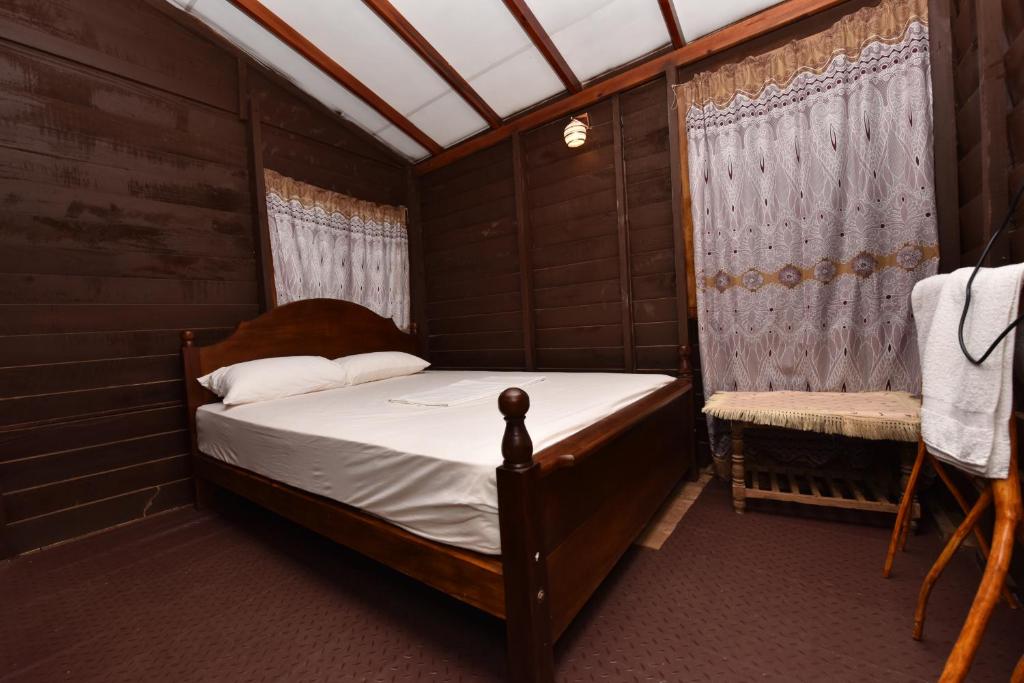 Postel nebo postele na pokoji v ubytování Pidurangala View Home Stay