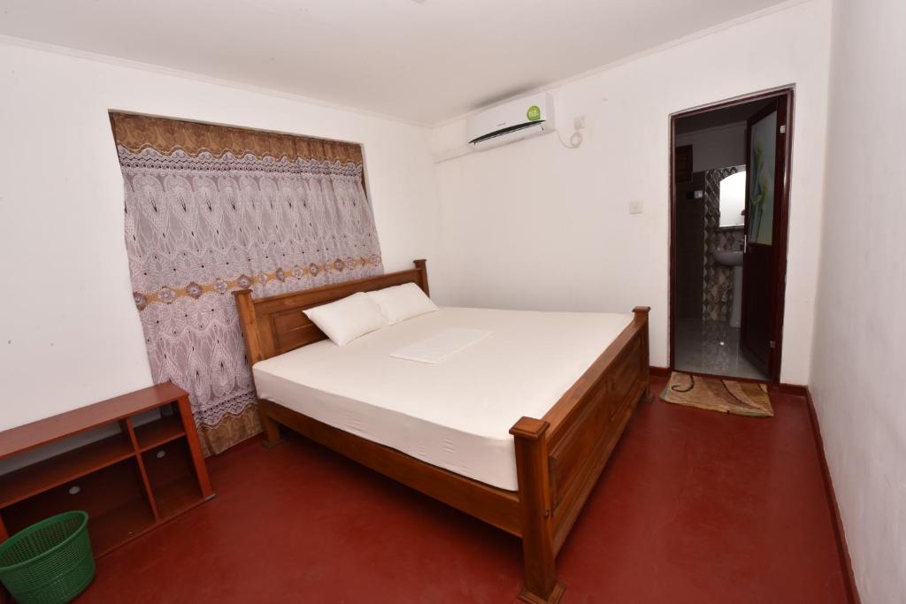 Postel nebo postele na pokoji v ubytování Pidurangala View Home Stay