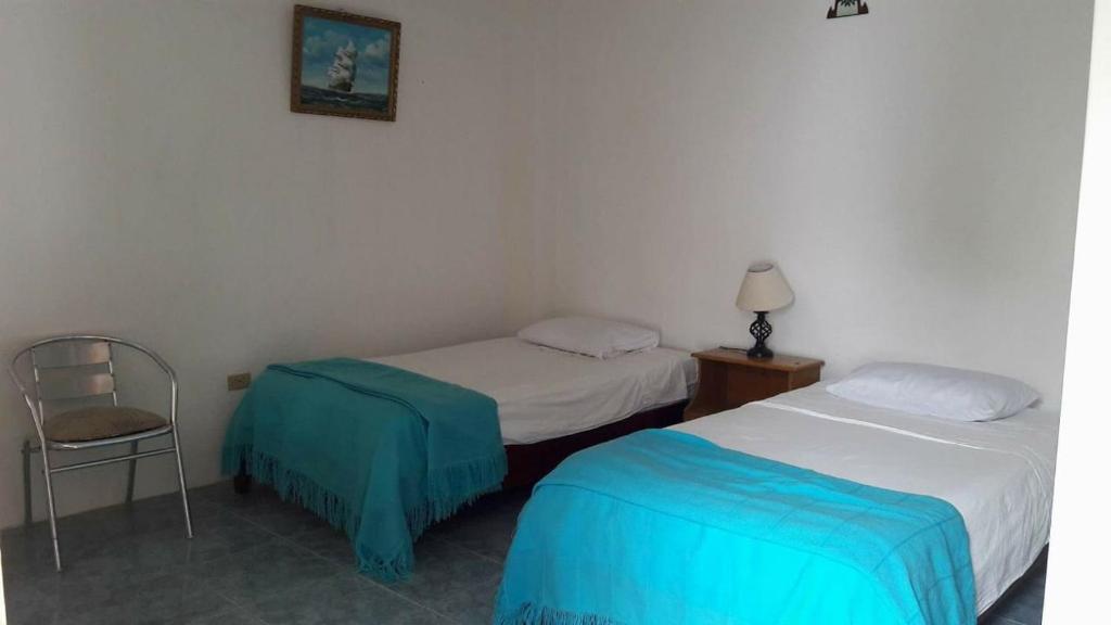 Postel nebo postele na pokoji v ubytování Hospedaje Sarita