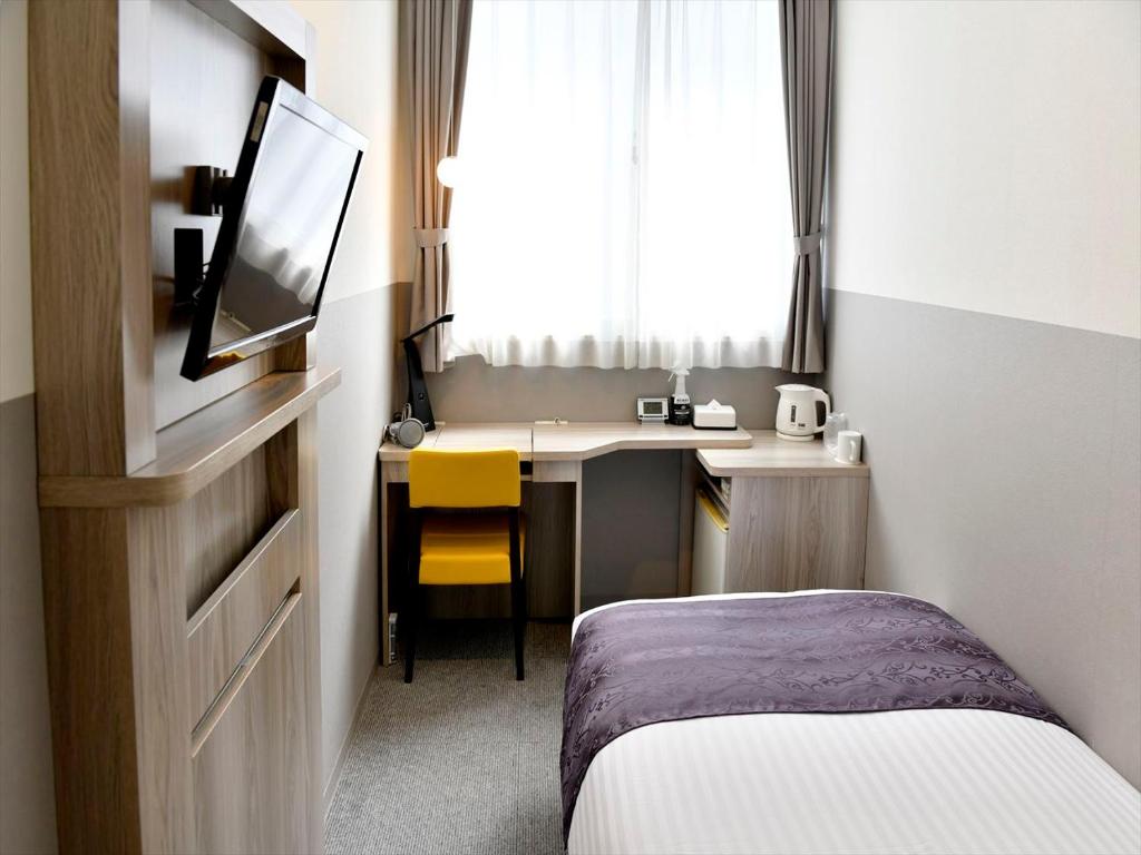 TV a/nebo společenská místnost v ubytování New Commander Hotel Osaka Neyagawa