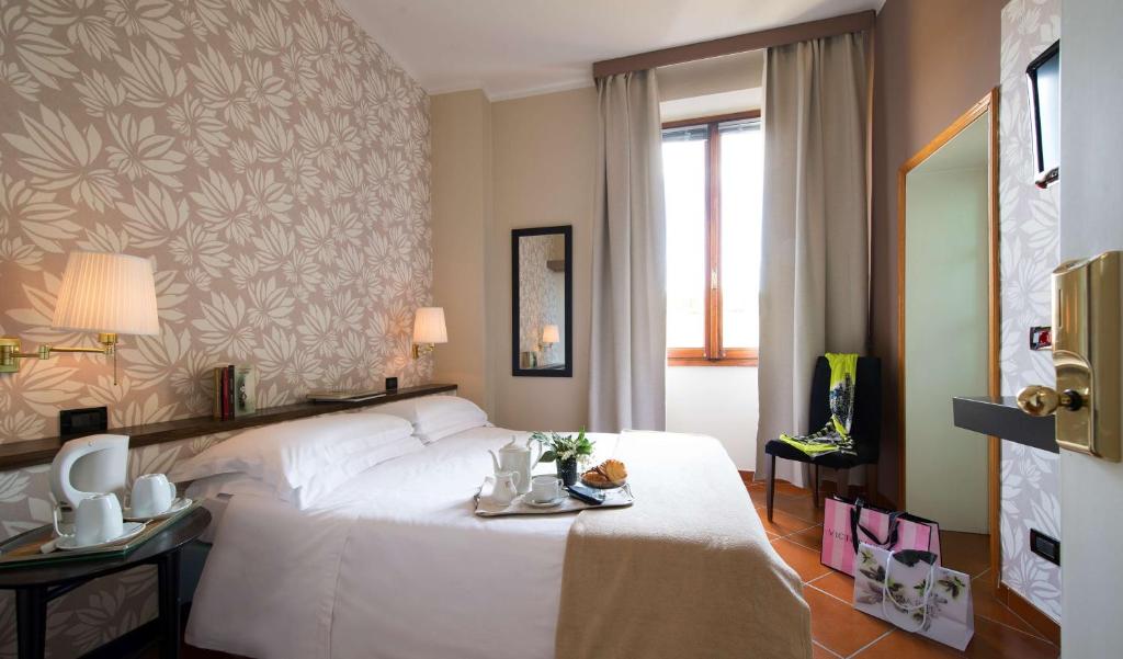 Posteľ alebo postele v izbe v ubytovaní Hotel De La Pace, Sure Hotel Collection by Best Western