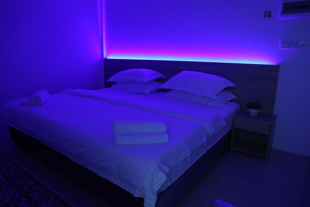 Postel nebo postele na pokoji v ubytování Moodhu Surf House