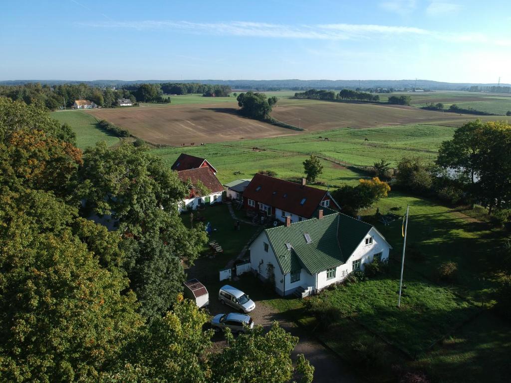 an aerial view of a house in a field at Lilla Trulla Gårdshotell - Feels like home in Bolestad