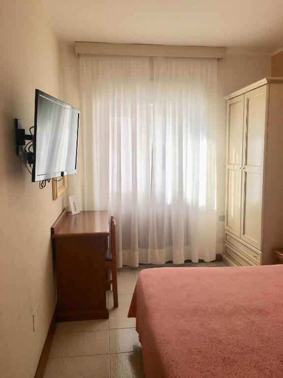 TV a/nebo společenská místnost v ubytování Hotel Sporting