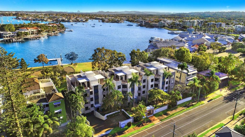 an aerial view of a city with a river and buildings at Spinnaker Quays in Mooloolaba